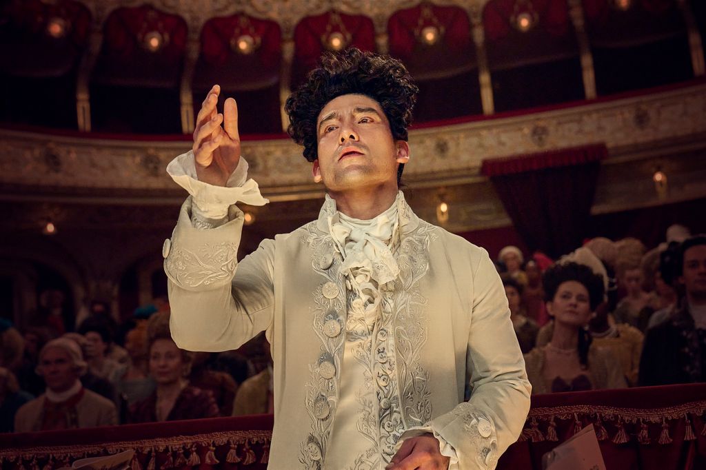 MAN IN PERIOD CLOTHING IN THEATRE